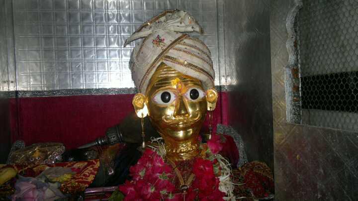 Lord shiva gold idol kamnathmahadev temple radh image 1